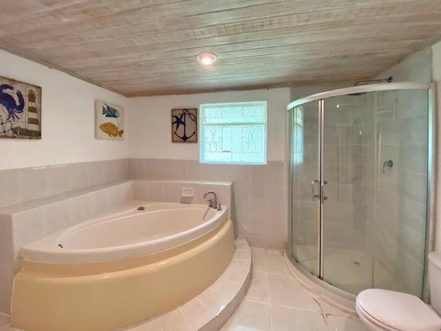Banff Springs Sandy Lane Barbados Master Bathroom With Tub and Shower