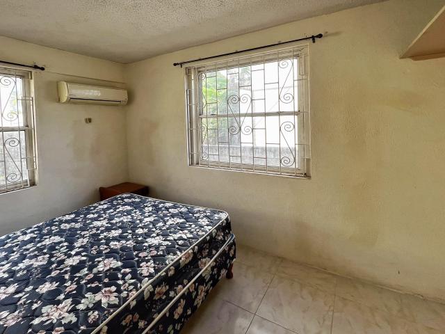 Standel Apartment Suites For Sale Bedroom with Queen Bed and AC