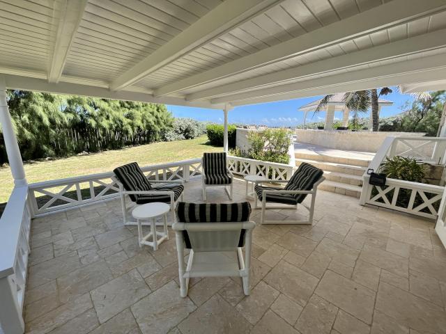 Paradise Point Oceanfront Home For Sale In Barbados Covered Patio with Seating