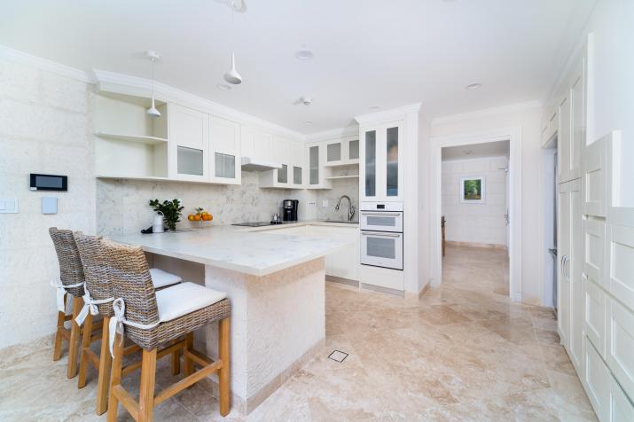 The Crane Residences Barbados Unit 5252 For Sale Kitchen with Breakfast Island and Seating