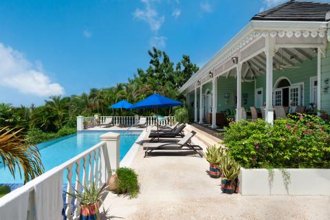 Villa Irene 4 Bedroom Home For Sale In Barbados Outside Pool Deck with Loungers and Sun Umbrellas